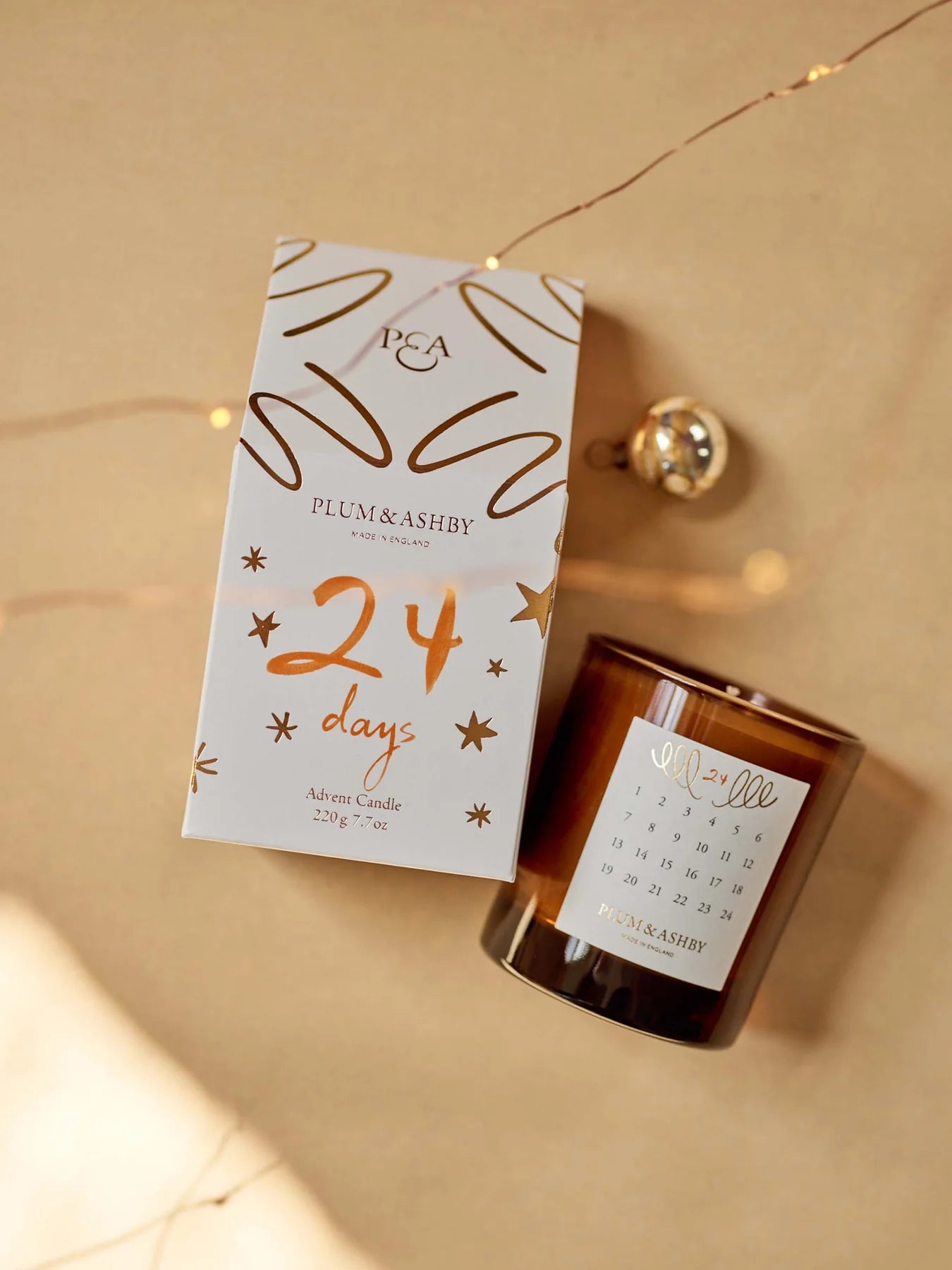 The Every Space Cedarwood and Pine Needle seasonal advent candle by Plum & Ashby presented in a gift box with detachable Christmas decoration