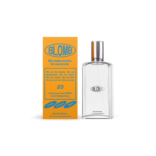 50ml bottle of Blomb No. 23 Eau de Parfum with a silver cap, alongside its orange packaging that has branding and product information.