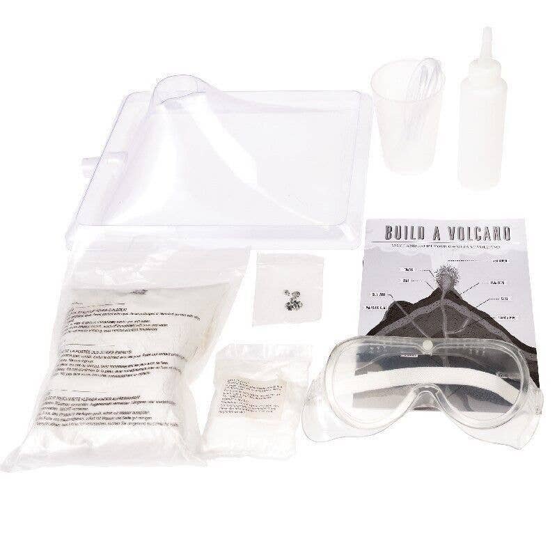 Science experiment kit with goggles, chemicals, and instructions on a white background