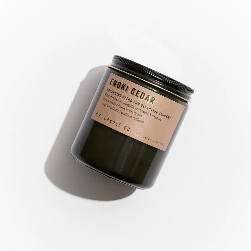 Enoki Cedar 7.2 oz Soy Candle, hand-poured into apothecary-inspired amber jars with signature kraft label and a brass lid, by PF Candle Co.