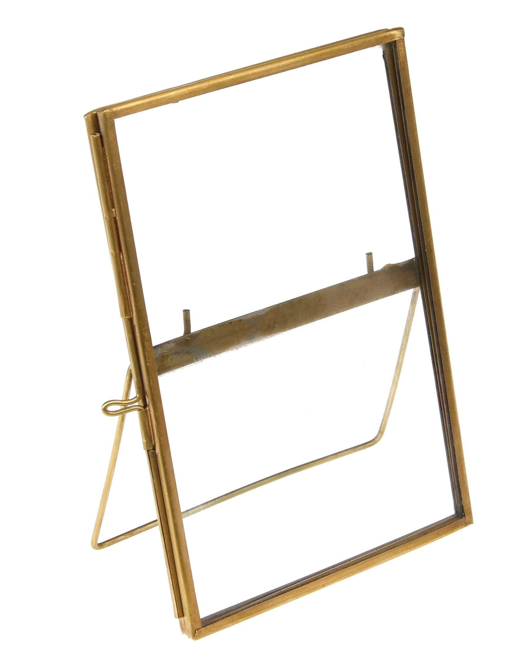 Gold-framed mirror on a white background