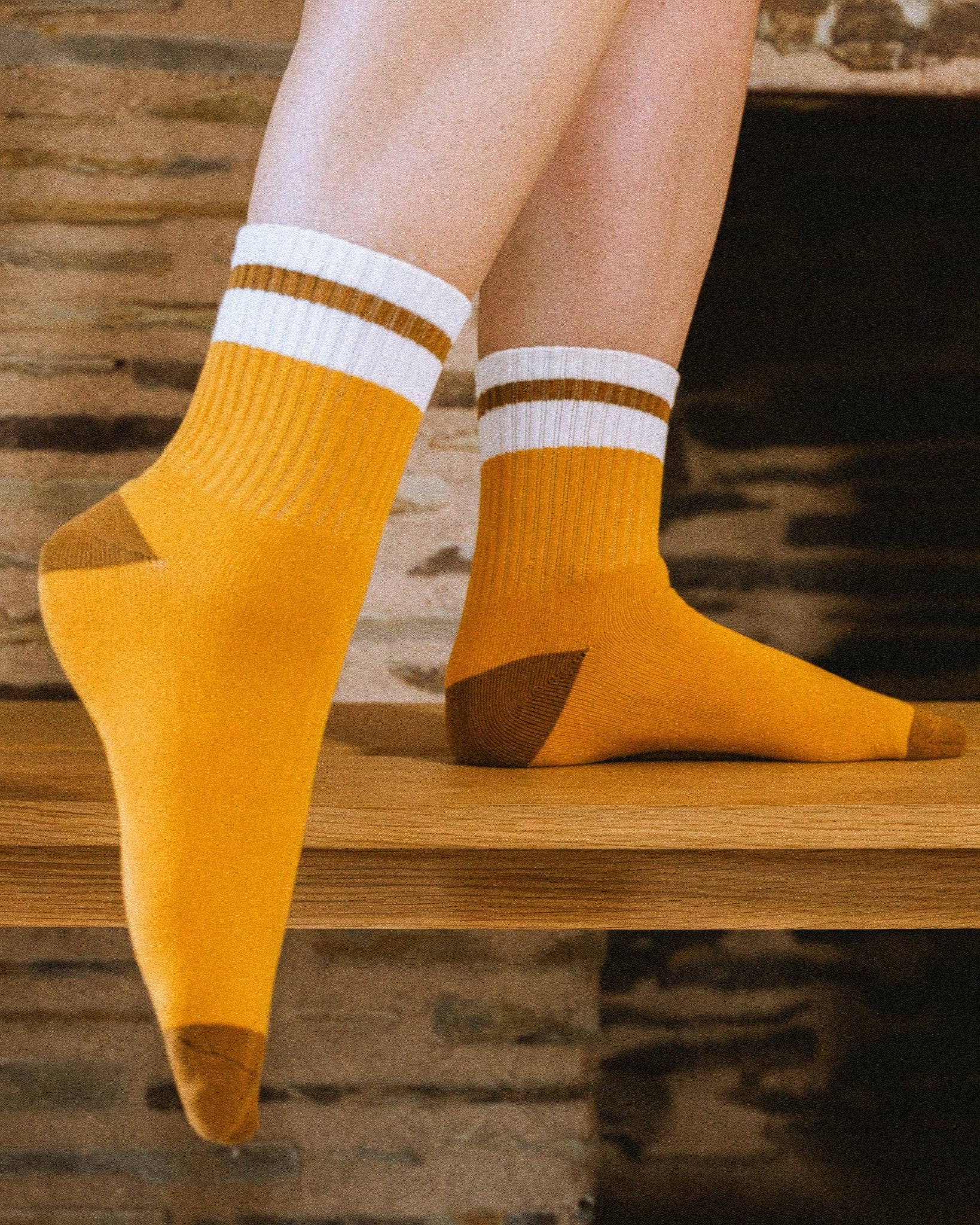 Feet wearing marigold varsity sock
