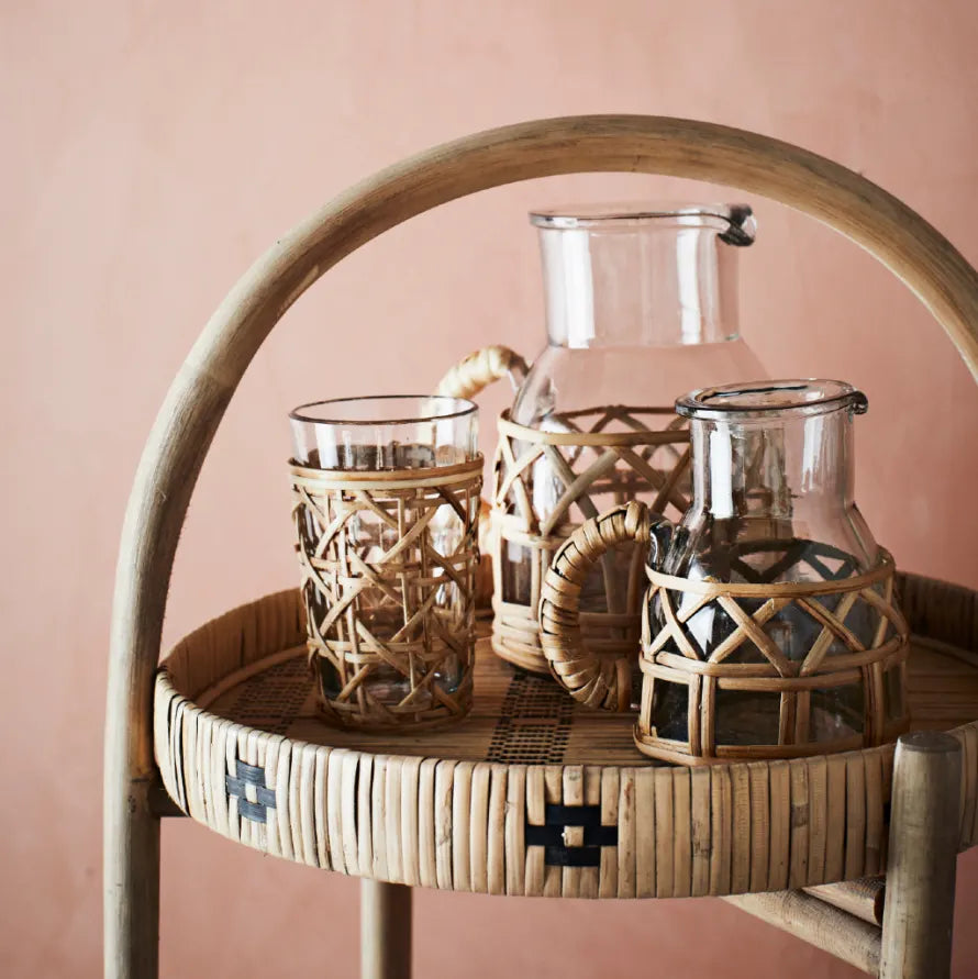 The Every Space bohemian style Glass Jug with bamboo cane surround and handle by Madam Stoltz