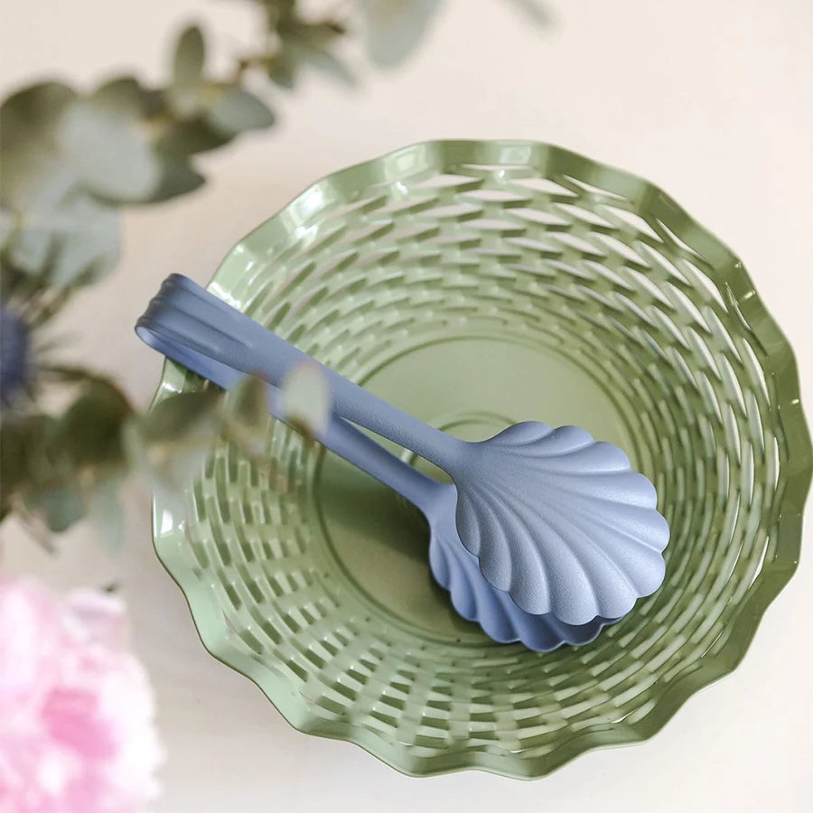 The Every Space scalloped, vintage pastel blue Bread Tongs in stainless steel with a matt finish by Roger Orfevre