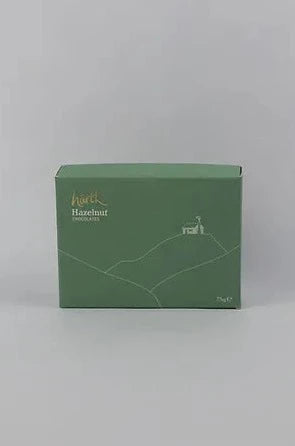 Six vegan dark chocolate hazelnut truffles made with organic dark chocolate and a tasty hazelnut filing by Harth