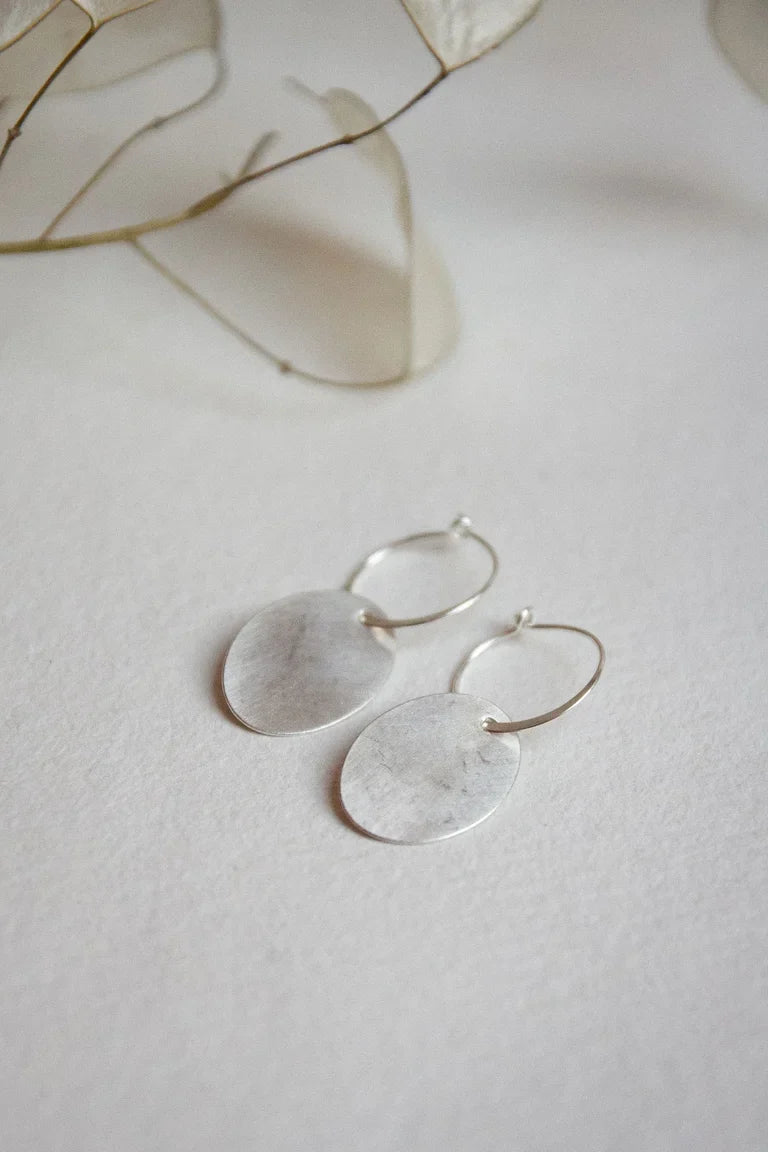 The Every Space handmade recycled sterling silver oval hoop earrings with sterling silver hoops and oval disc by Clare Elizabeth Kilgour