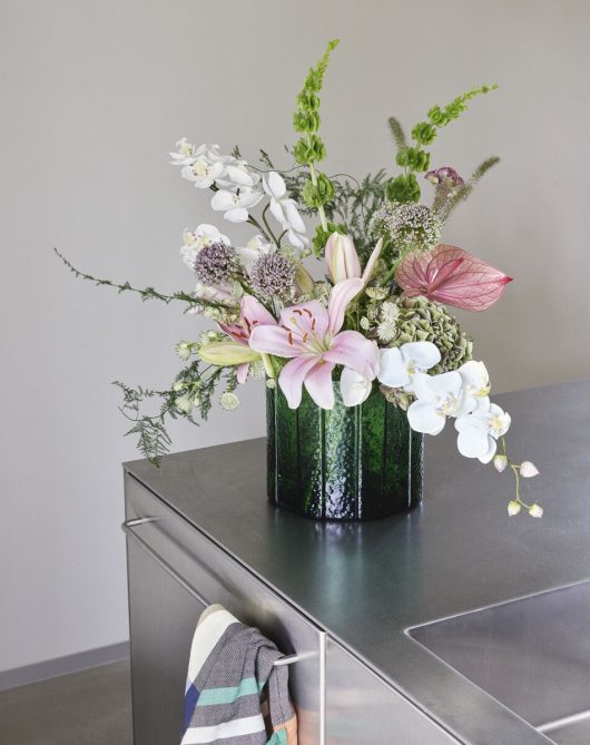 The Every Space deep green Emerald Vase for flowers, in textured glass by Hübsch