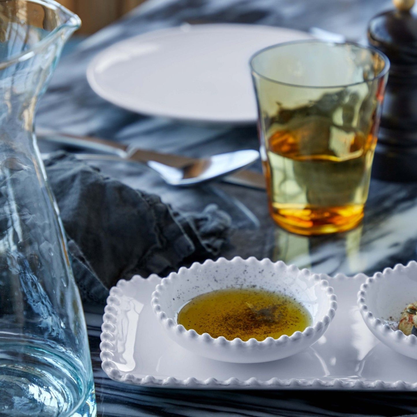 The Every Space fine stoneware mini white bowl with pearl style edging detail by Costa Nova