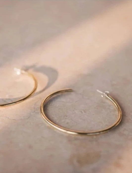 The Every Space brass hoops made using recycled brass by Clare Elizabeth Kilgour, with sterling silver pins and scrolls