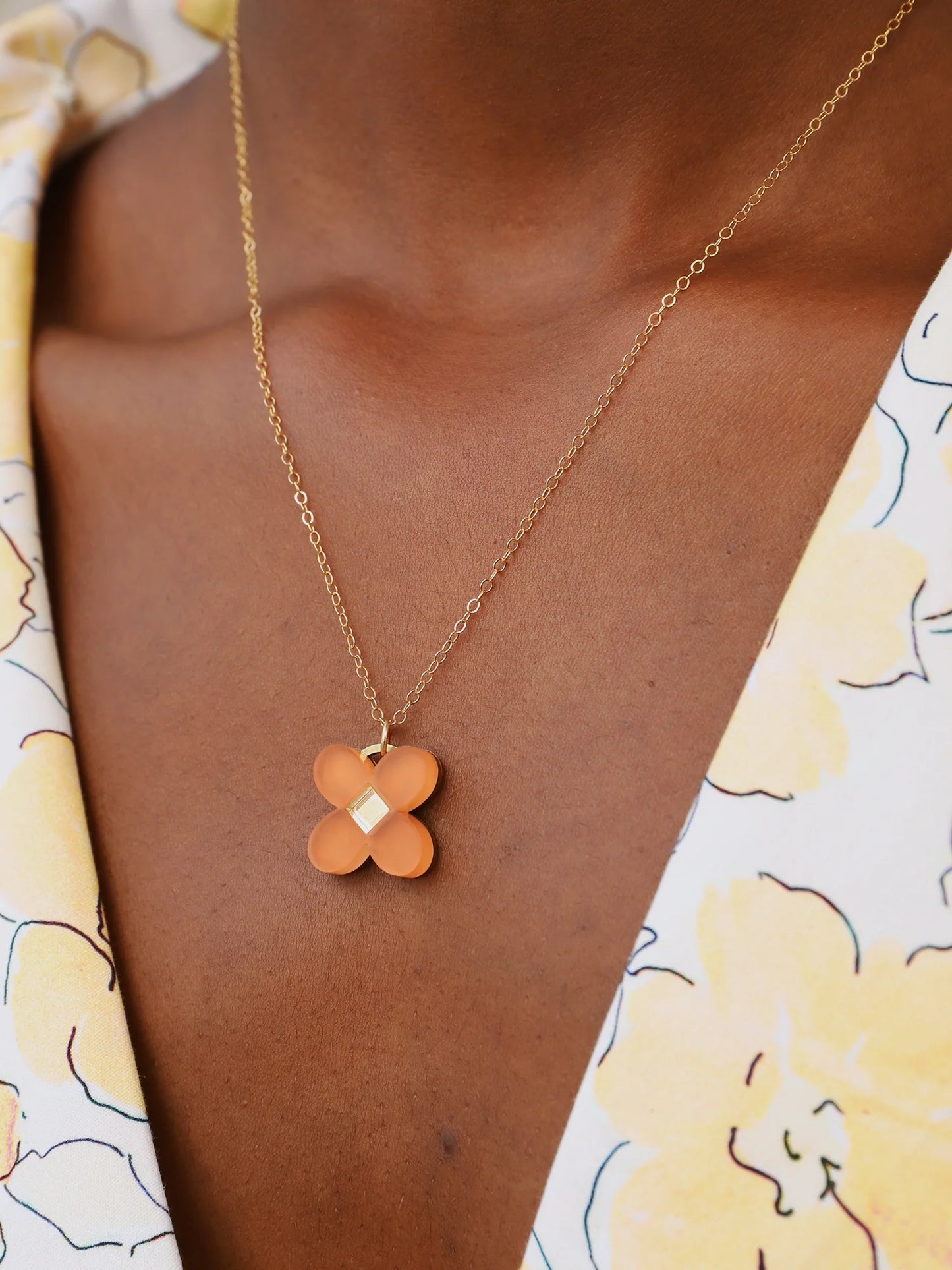 The Every Space Bella necklace with filled gold chain and terracotta acrylic pendant by Wolf & Moon
