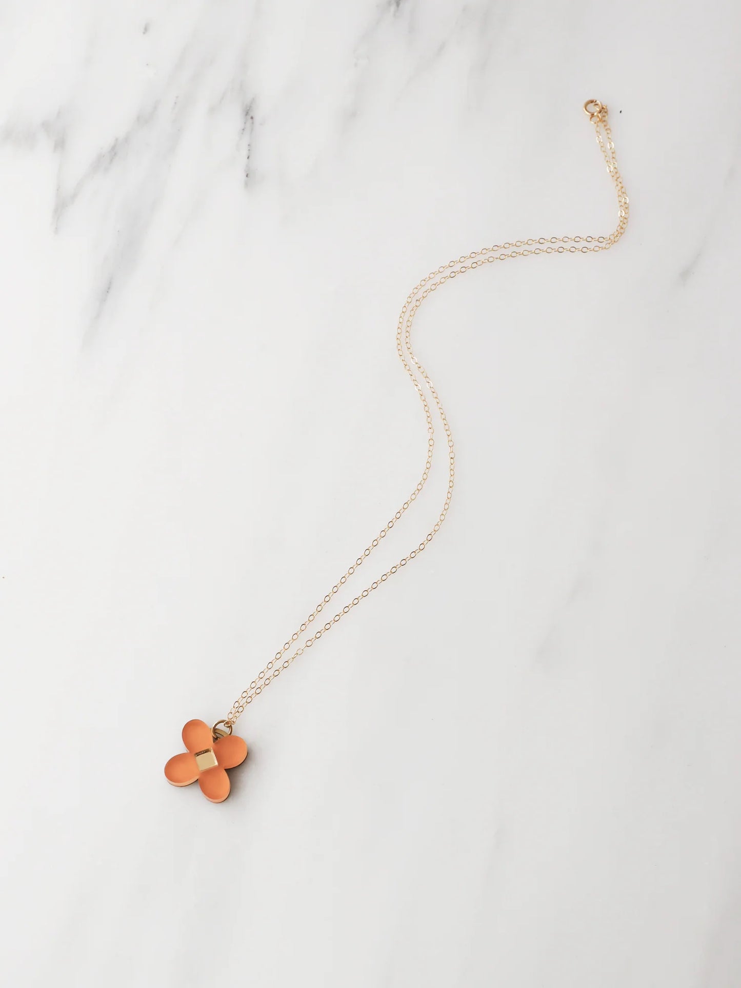 The Every Space Bella necklace with filled gold chain and terracotta acrylic pendant by Wolf & Moon