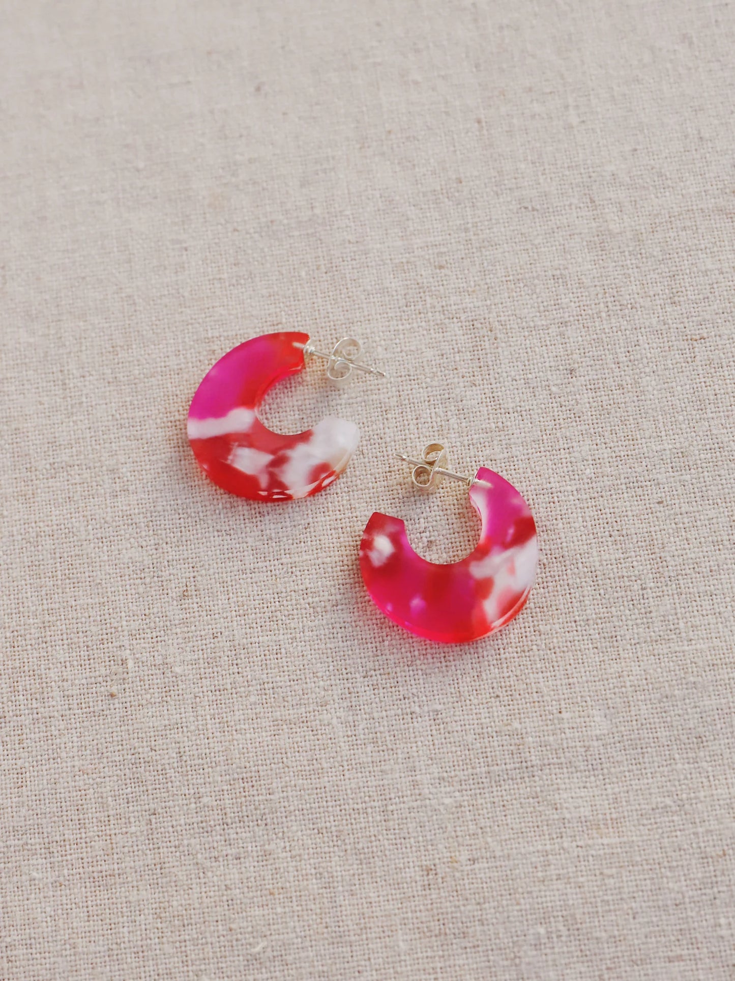 The Every Space Cassia hoop earrings in sterling silver and raspberry acrylic by Wolf & Moon