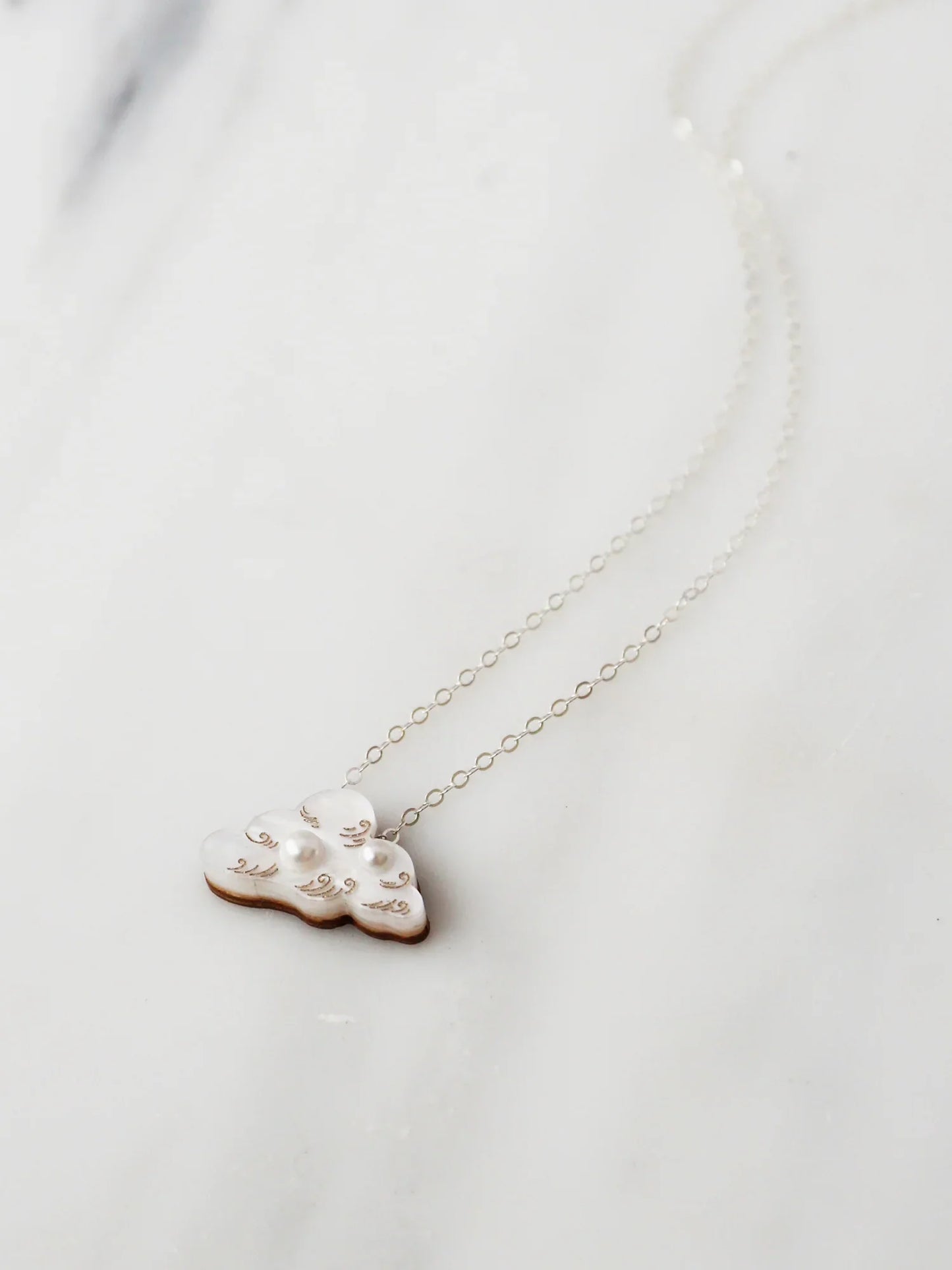 The Every Space Cloud necklace in sterling silver and acrylic by Wolf & Moon