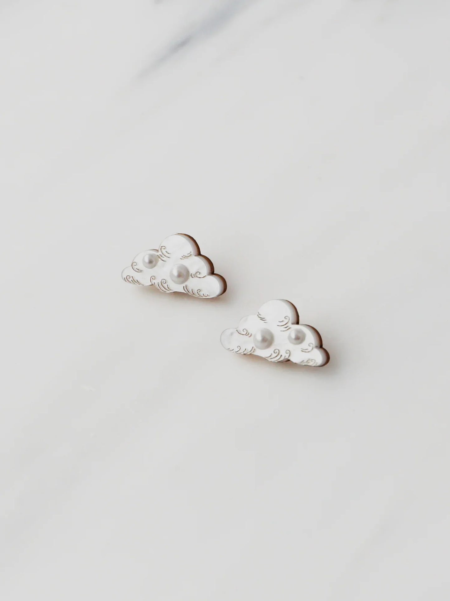 The Every Space Cloud stud earrings in sterling silver and acrylic by Wolf & Moon