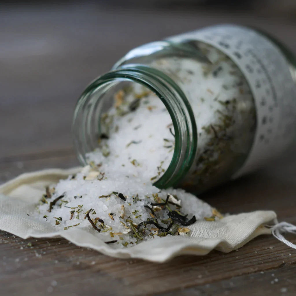 The Every Space glass jar of Energising Rosemary & Lemongrass Muscle Relief Bath Soak with Epsom bath salts by Yellow Gorse