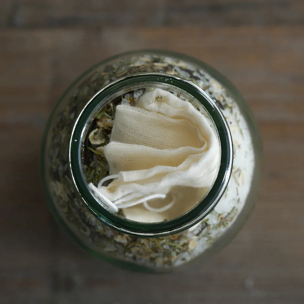 The Every Space glass jar of Energising Rosemary & Lemongrass Muscle Relief Bath Soak with Epsom bath salts by Yellow Gorse