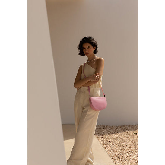 The Every Space high quality grain pink bloom vegan leather Half Moon shoulder bag with a black YKK zipper and an internal pocket by Monk & Anna