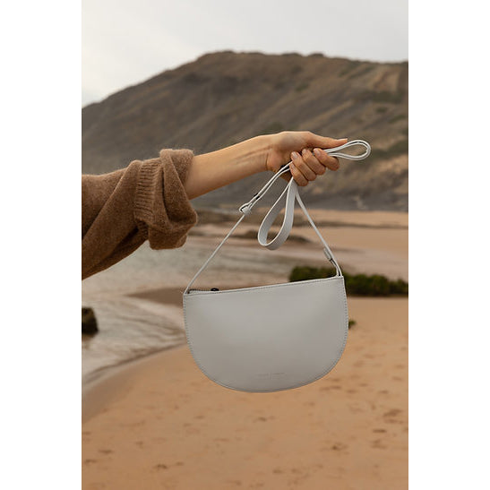 The Every Space high quality grain fog grey vegan leather Half Moon shoulder bag with a black YKK zipper and an internal pocket by Monk & Anna