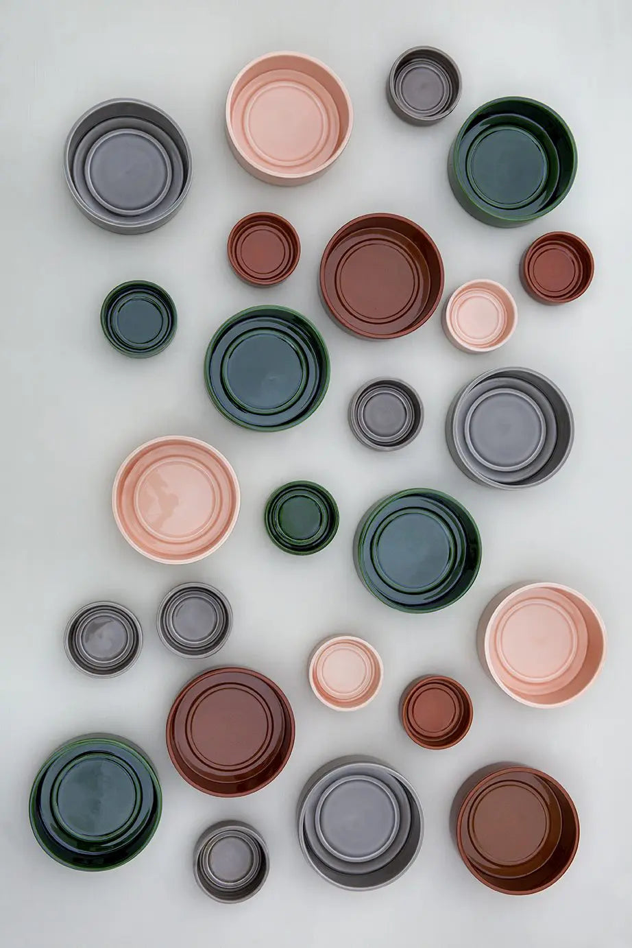 Many colour glazed hoof pots and saucers