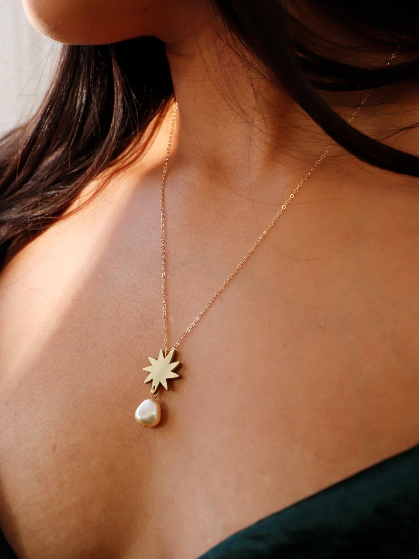 The Every Space Kara necklace with gold filled chain and brass pendant by Wolf & Moon
