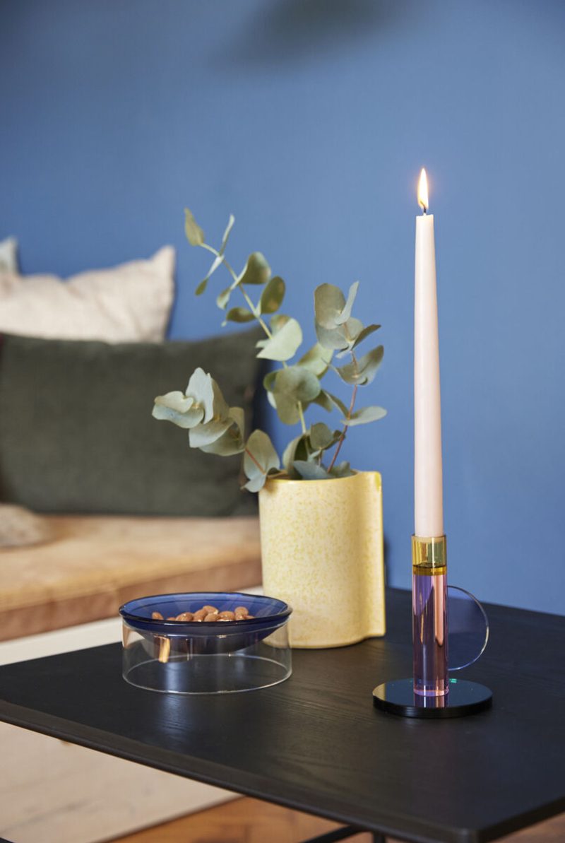 The Every Space Astro candle holder in pink, yellow, blue, and green crystal glass by Hübsch