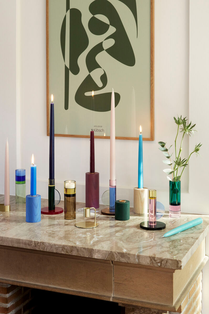 The Every Space Astro candle holder in pink, yellow, blue, and green crystal glass by Hübsch