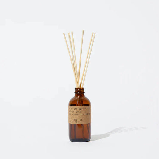 Sandalwood Rose 3 fl oz reed diffuser with fine fragrance oil in a 4 oz amber apothecary-inspired bottle with rattan reeds, by PF Candle Co.