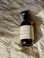 Cornflower and Meadow Rose Hand & Body Wash by Plum & Ashby in an amber glass bottle with pump