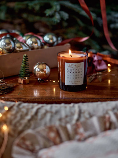 The Every Space Cedarwood and Pine Needle seasonal advent candle by Plum & Ashby presented in a gift box with detachable Christmas decoration