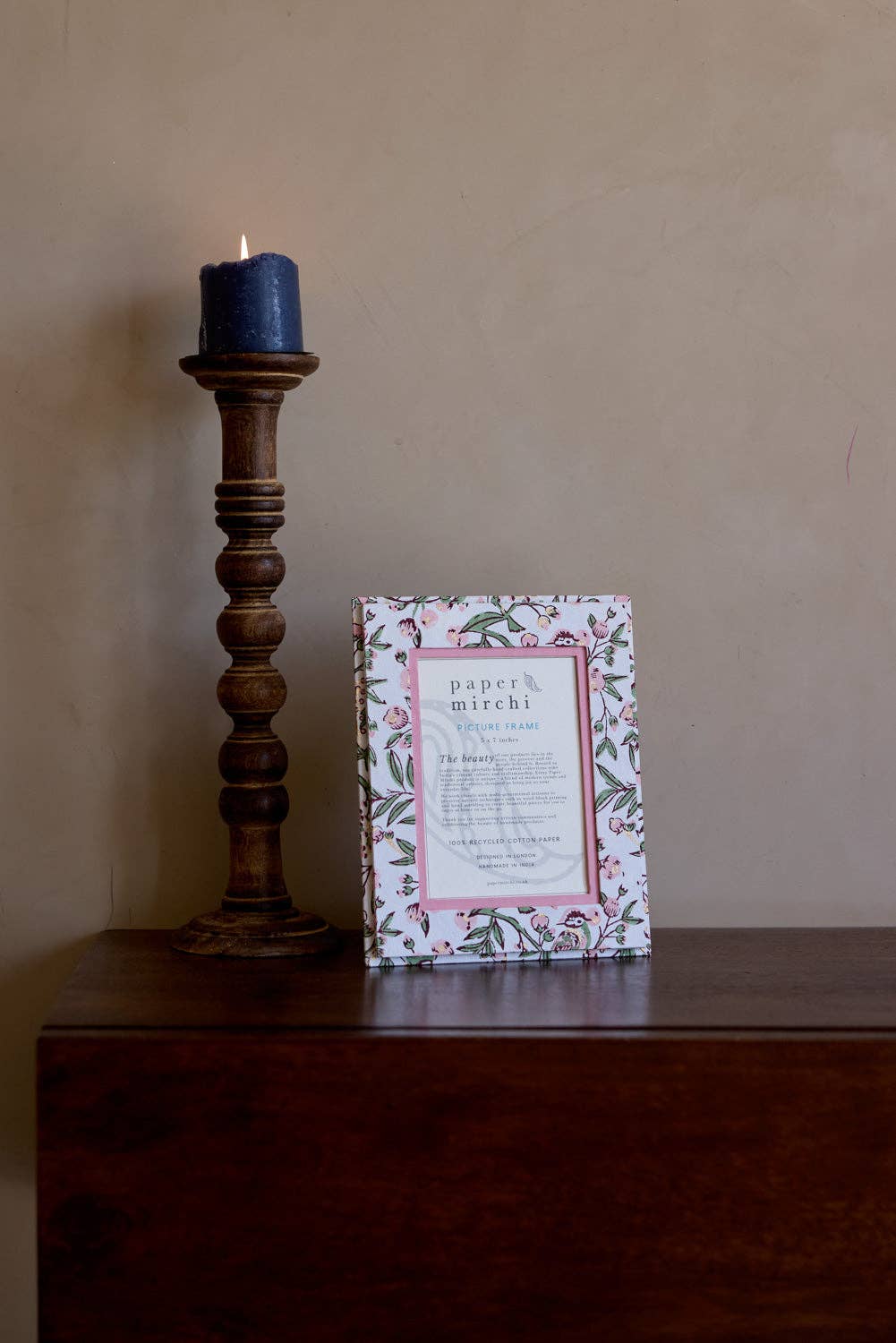 Floral patterned picture frame made from recycled cotton paper, on a white background