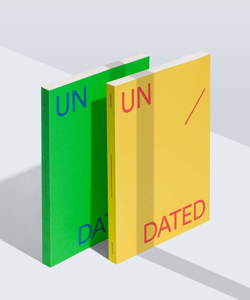 Two books, one green and one yellow, with 'UNDATED' text on a white background.