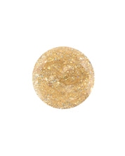 A circle of Aurora Glittery Gold water-based nail polish by Nailmatic