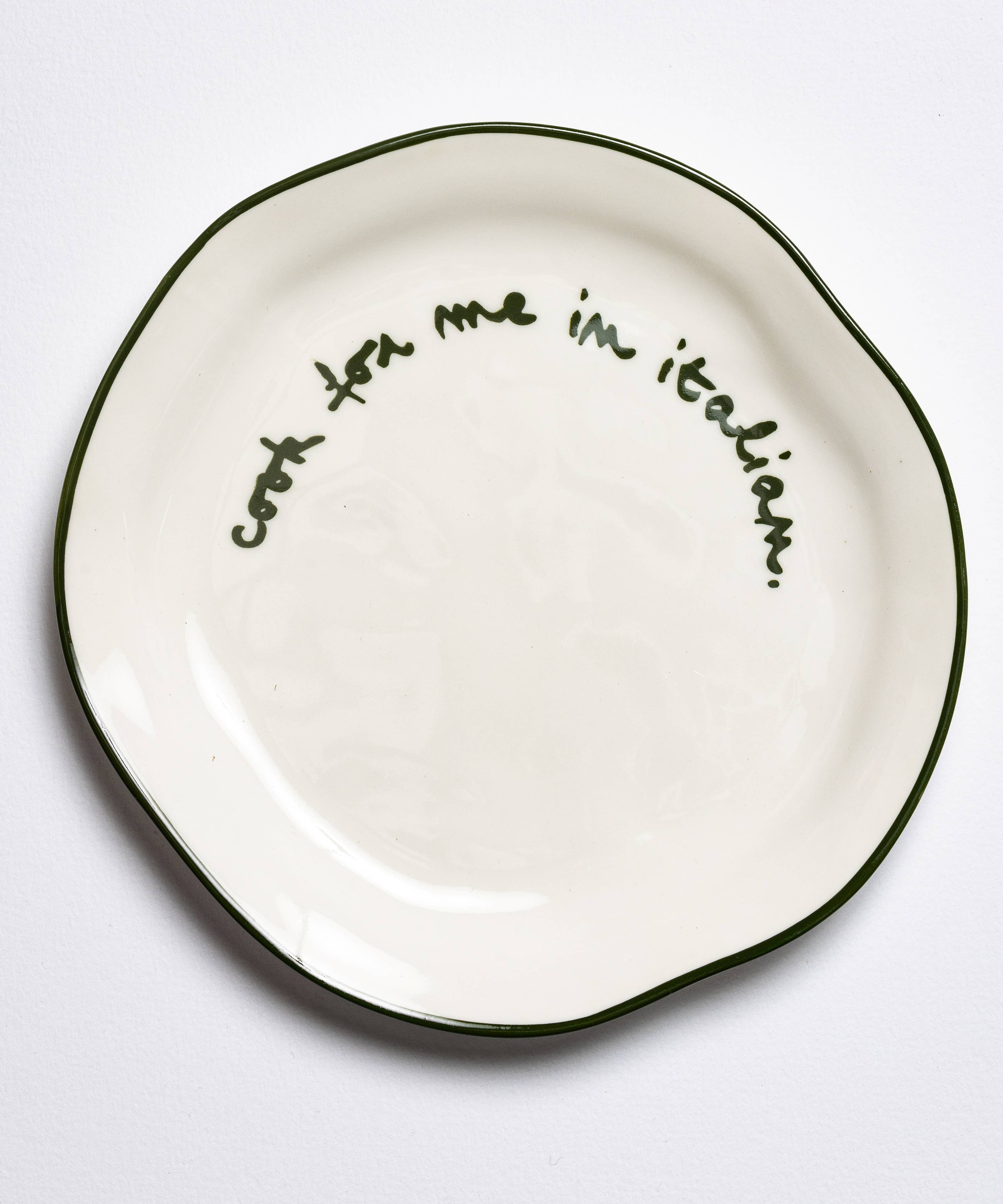 Slogan side plate shown on a table setting