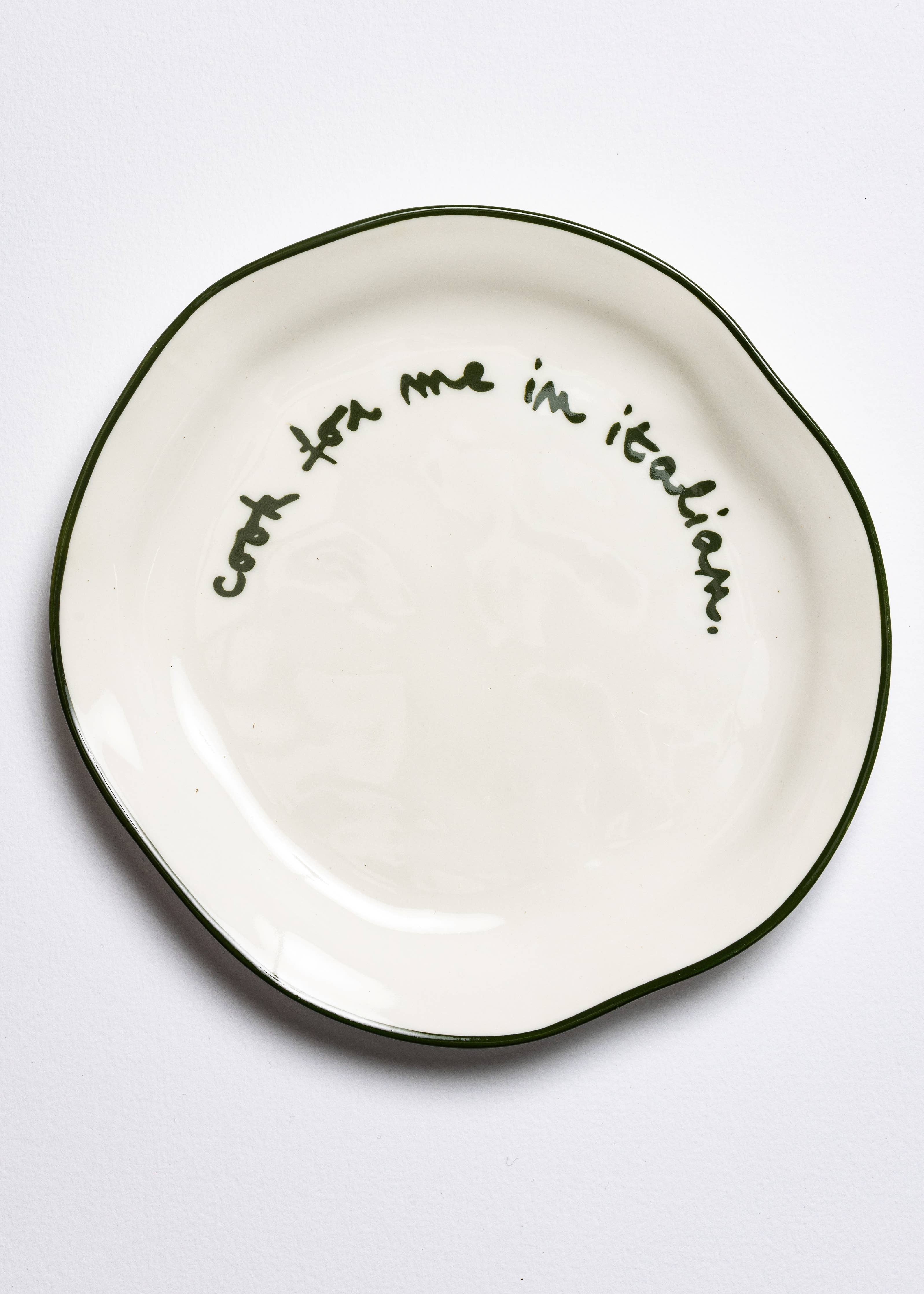 Slogan side plate shown on a table setting