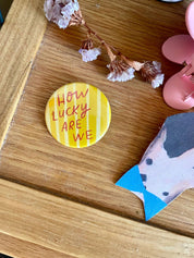 "How Lucky Are We" Badge