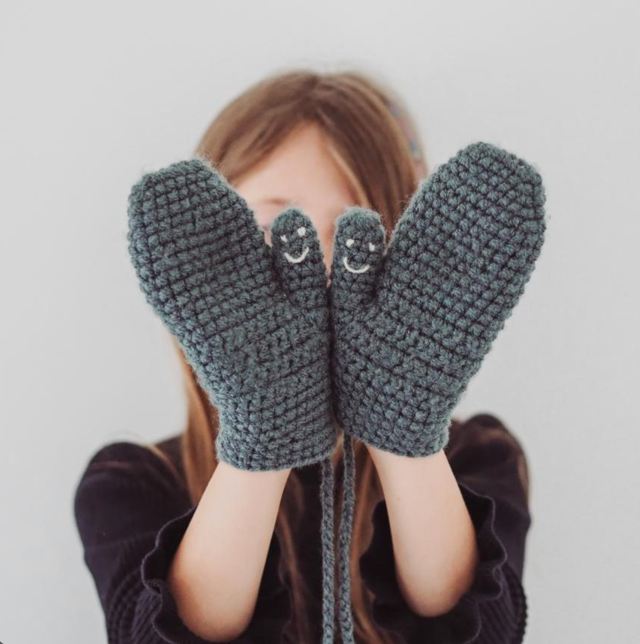 Smiley face mittens by EKA, further view