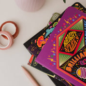 Bright Ideas A5 Notebook with bright, psychedelic illustrations on a green background