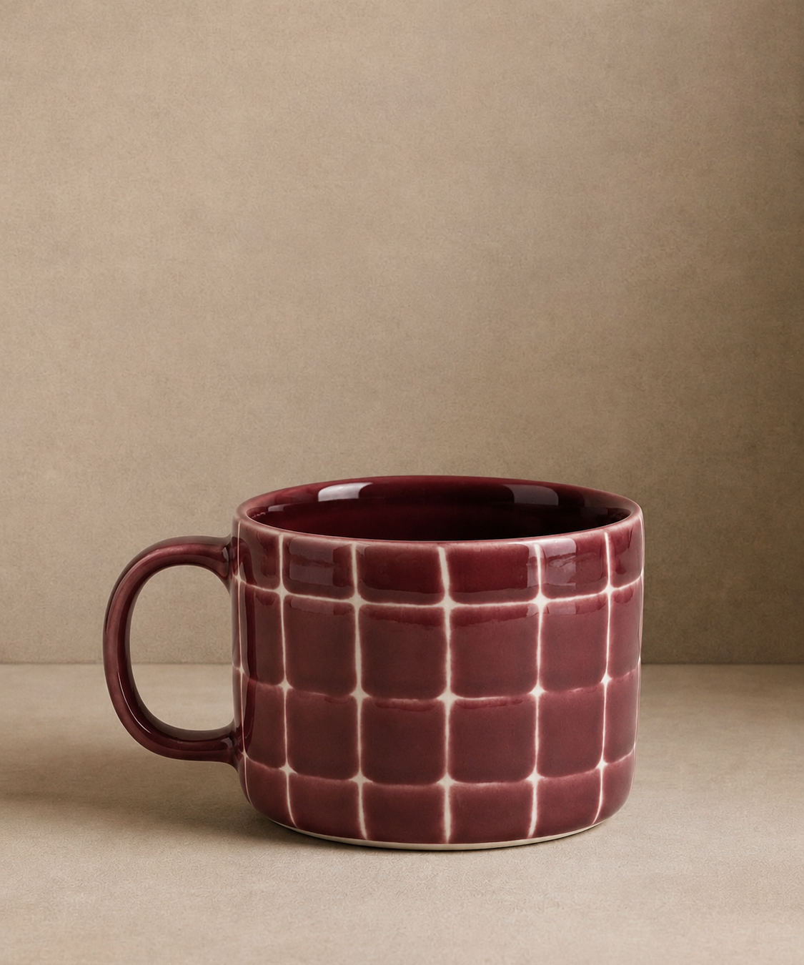 Egg Back Home handmade ceramic burgundy mug with geometric design 