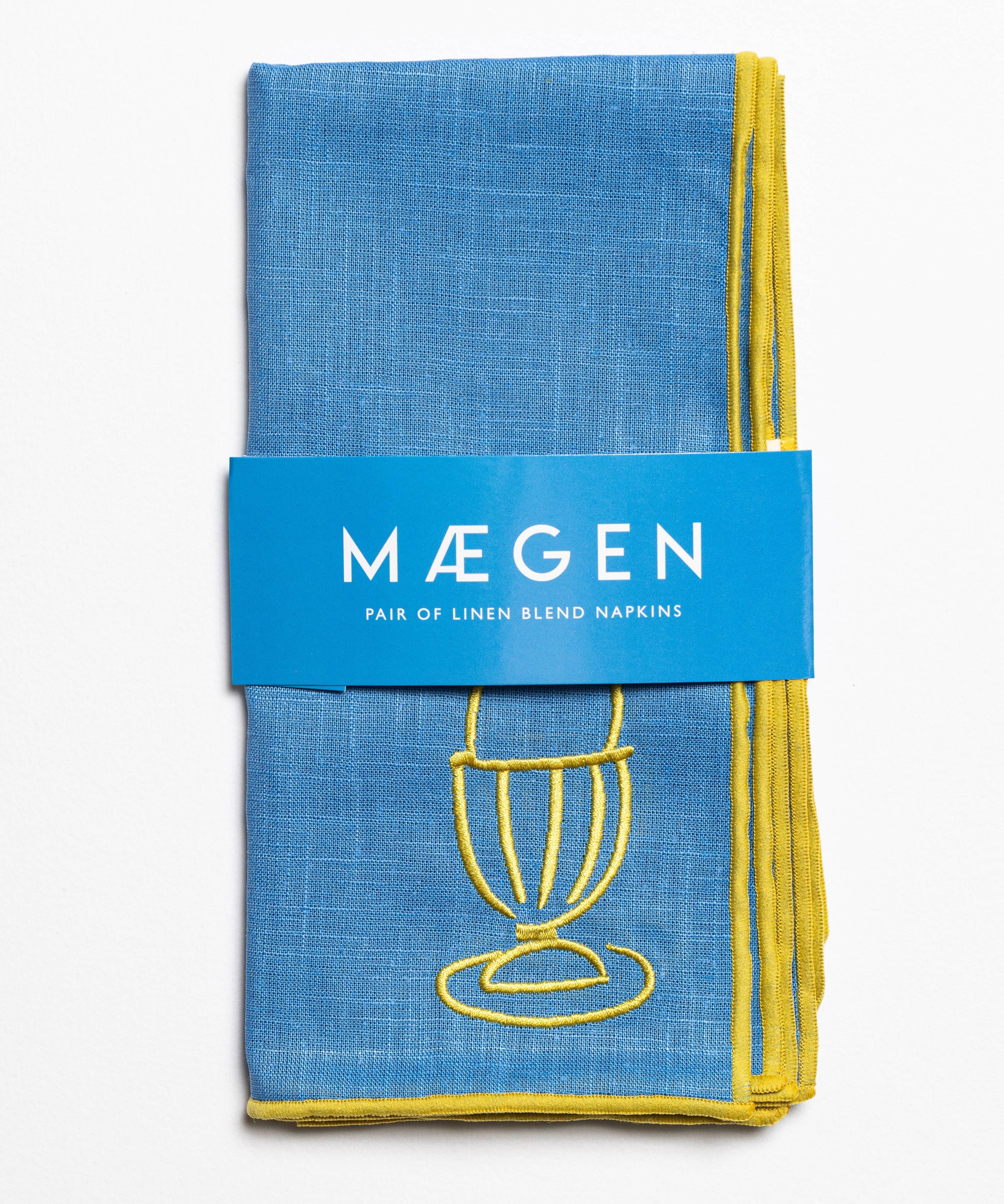Blue linen blend napkins with embroidered egg motif in a branded sleeve