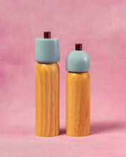Light blue salt and pepper grinder with a burgundy top