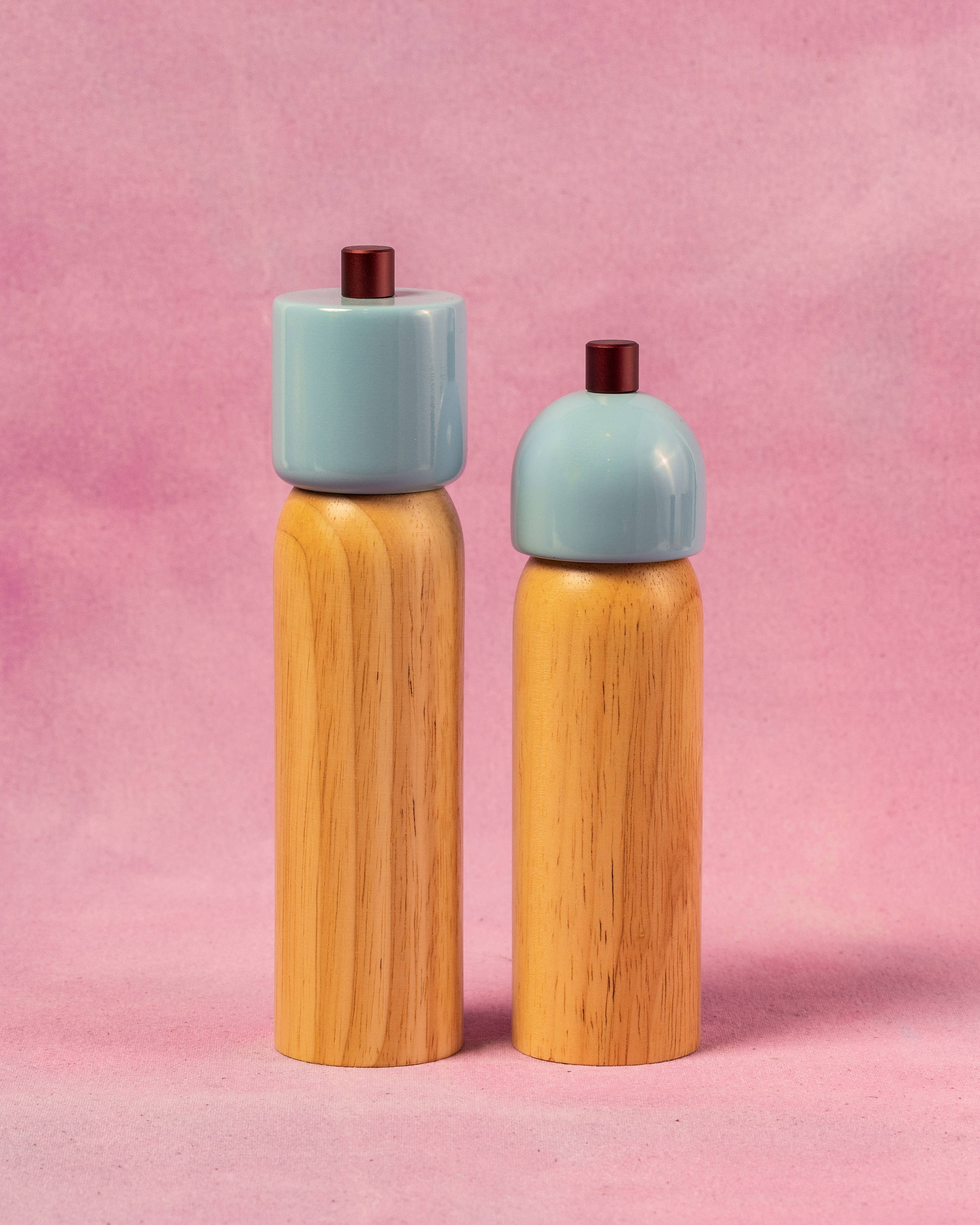 Light blue salt and pepper grinder with a burgundy top