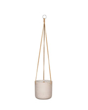 Beige hanging planter with a natural rope on a white background