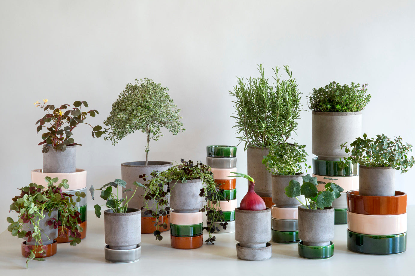 Hoff pots and saucers in various sizes and colours