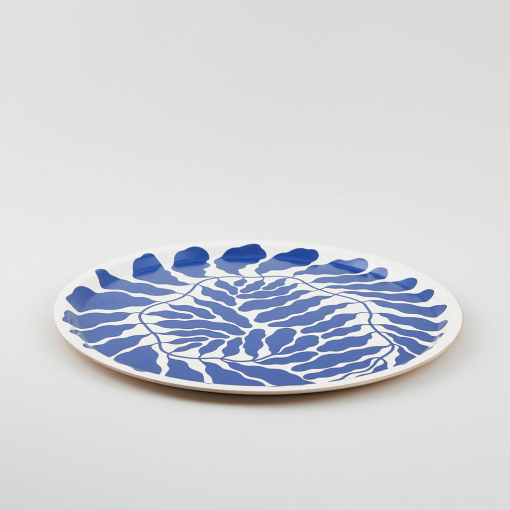 Large round tray with blue leaves designed by Linnea Anderson for Wrap
