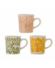 Set of three ceramic mugs with floral patterns on a white background