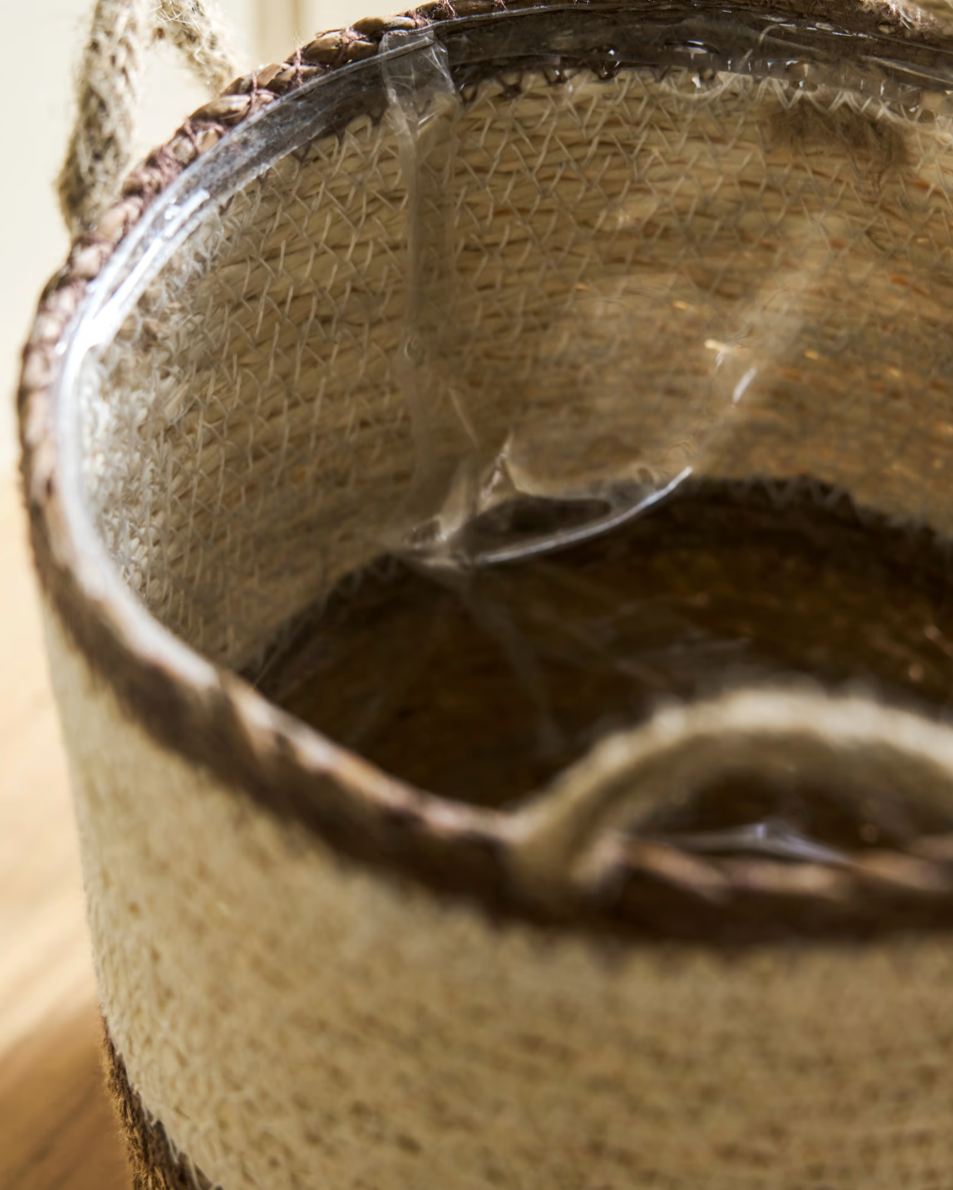 Close-up of a brown leather shoe with a clear plastic strip inside.