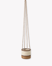Hanging planter with natural material on a white background