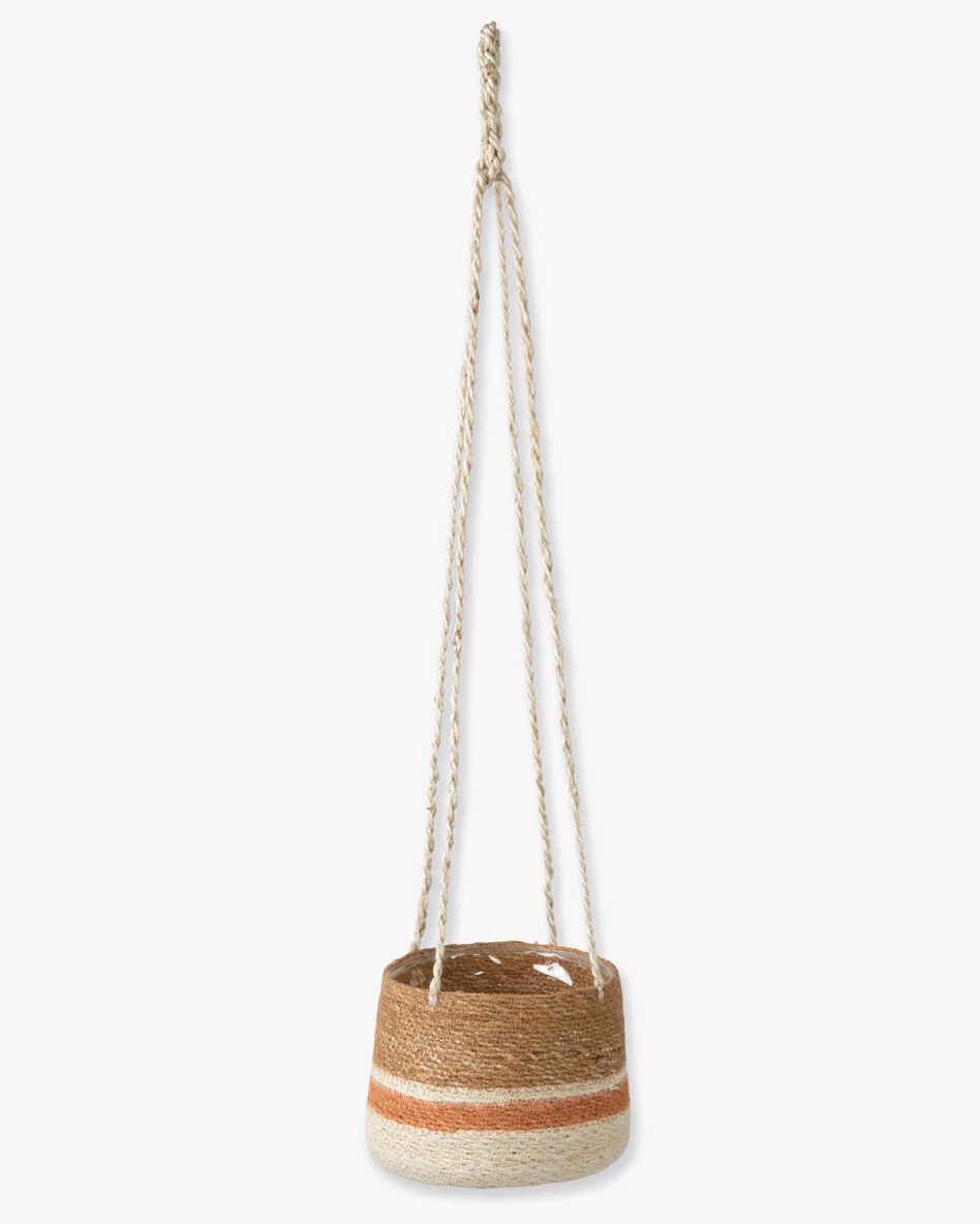 Jute hanging planter with striped design on a white background