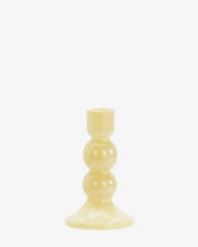 Yellow candle holder on a white background