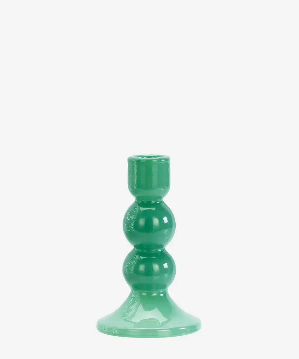 Green candle holder on a white background
